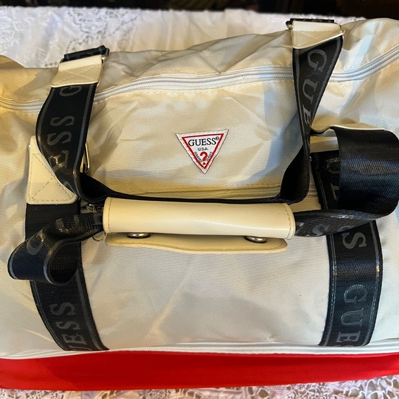 Guess white/cream colored, tote with extra red storage on the bottom. - Picture 7 of 7
